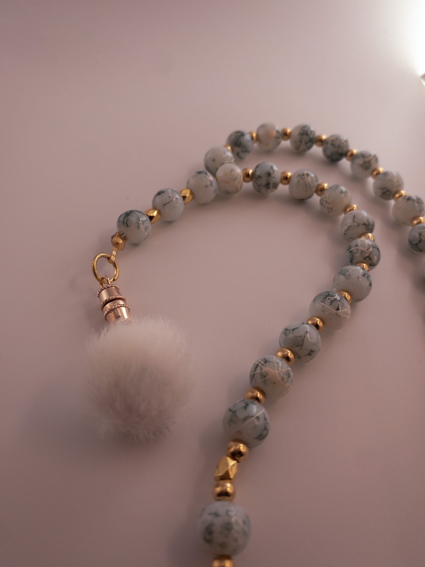 marbelled sebha with white pom pom