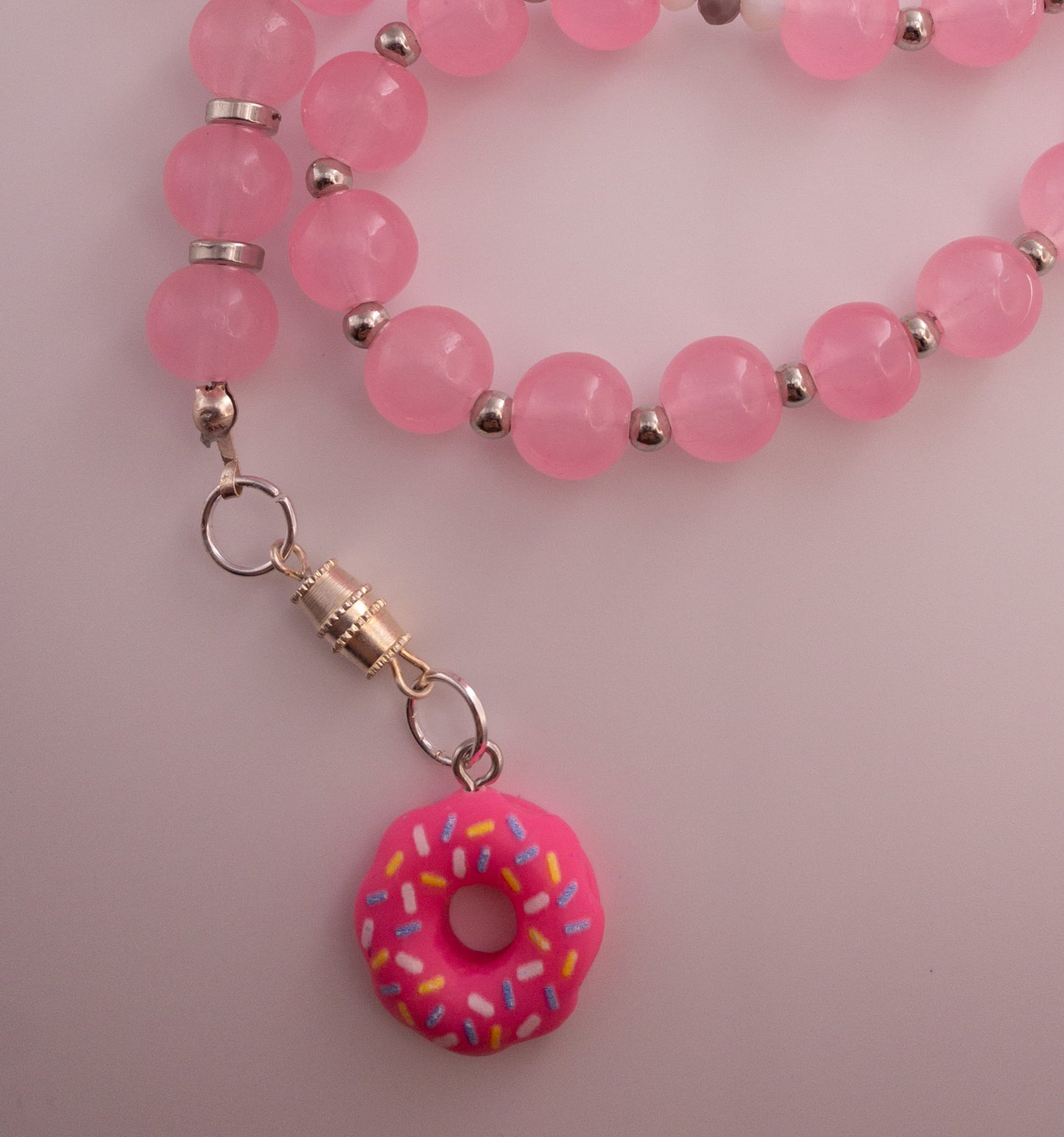 pink glass beads sebha with donut