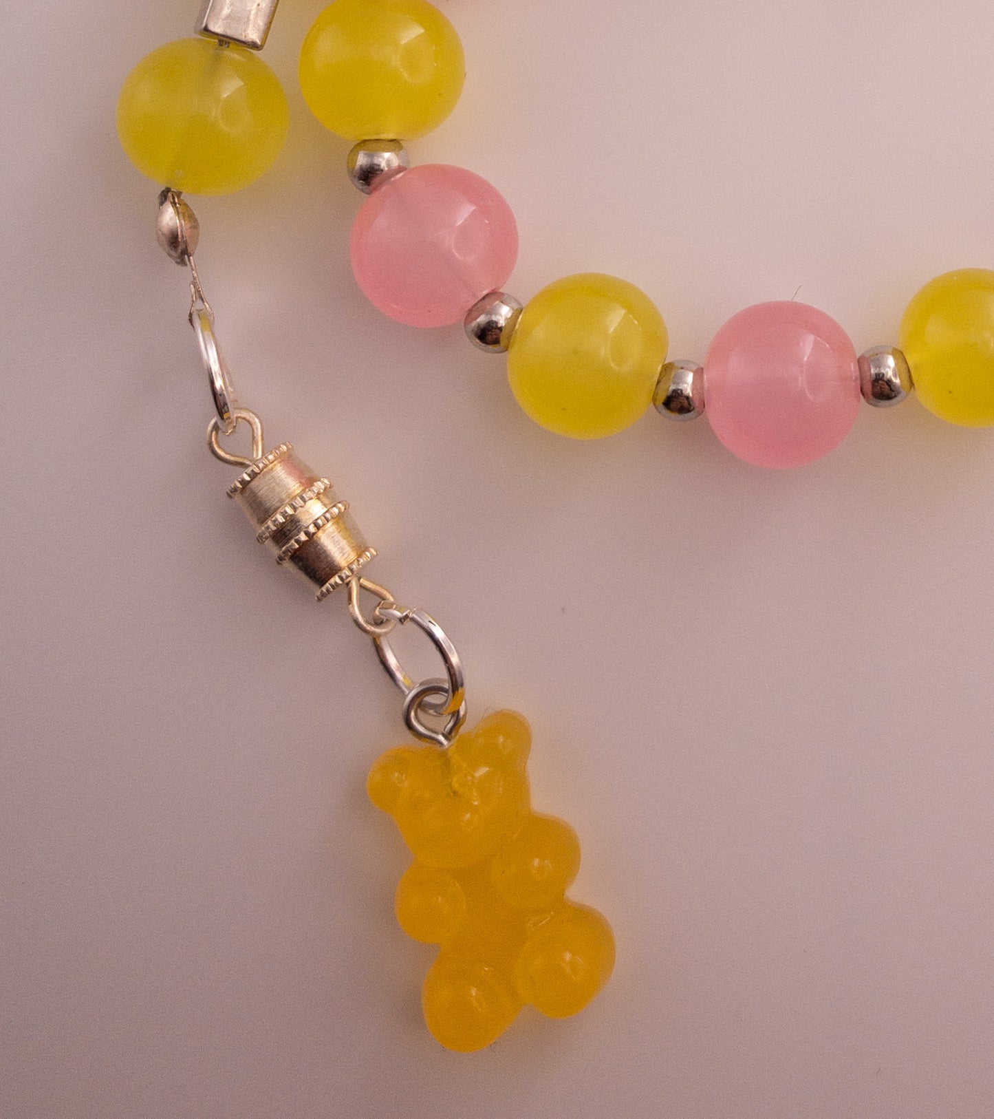yellow and pink glass bead sebha with orange bear