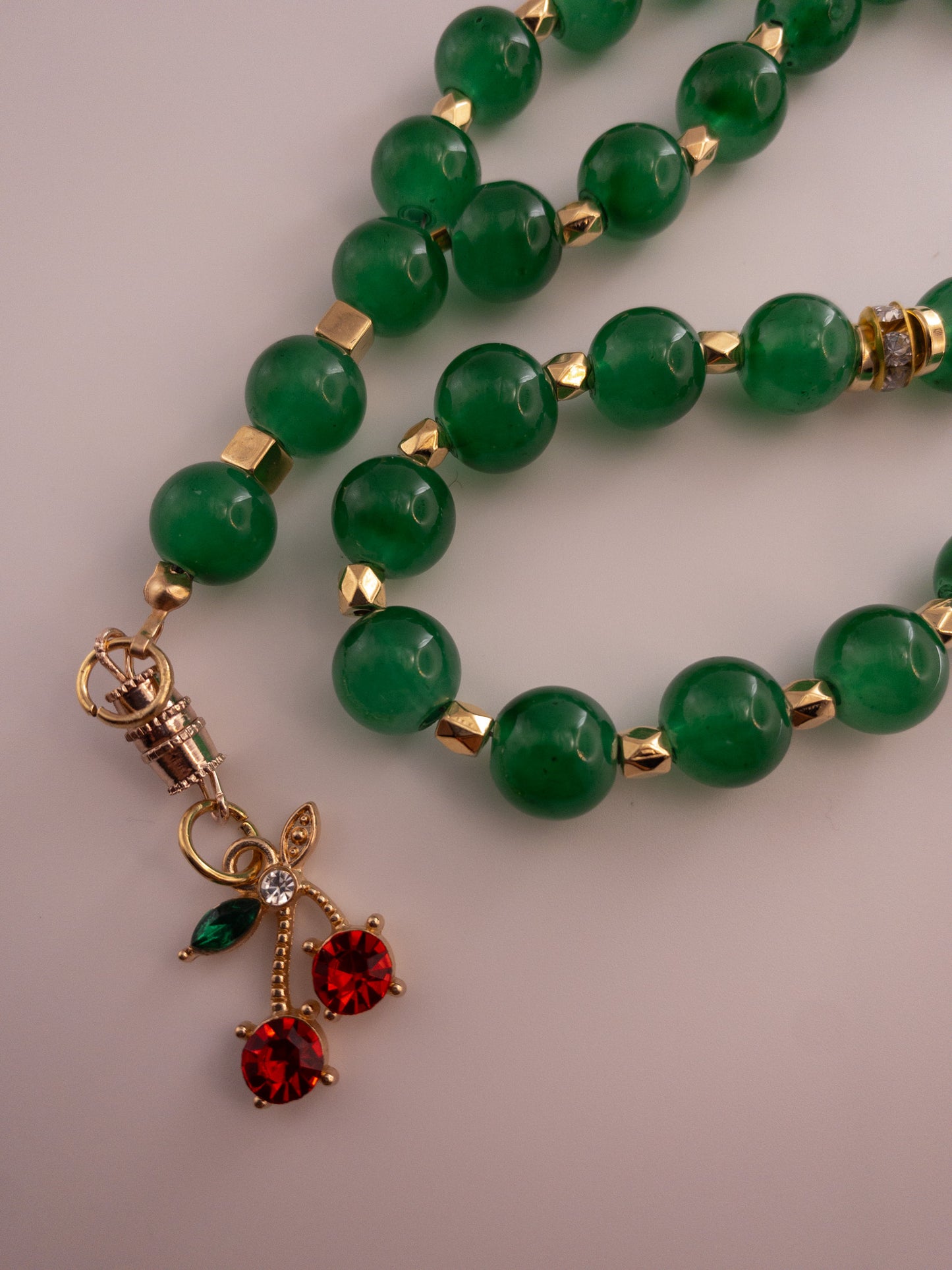 green glass bead sebha with cherry