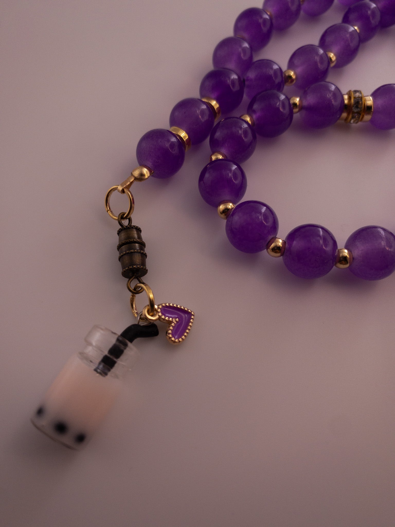 purple glass bead sebha with boba tea and heart