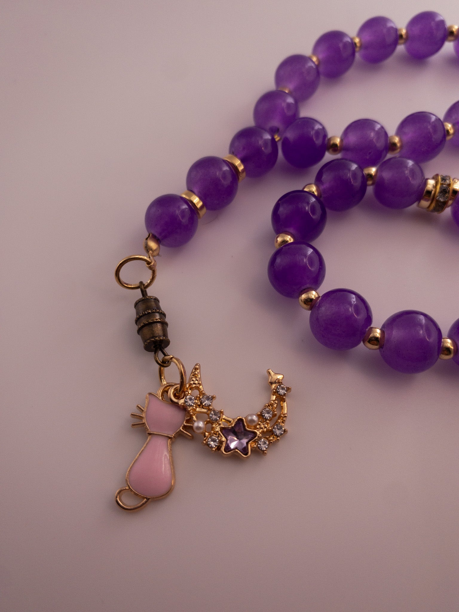 purple glass bead sebha with cat and moon